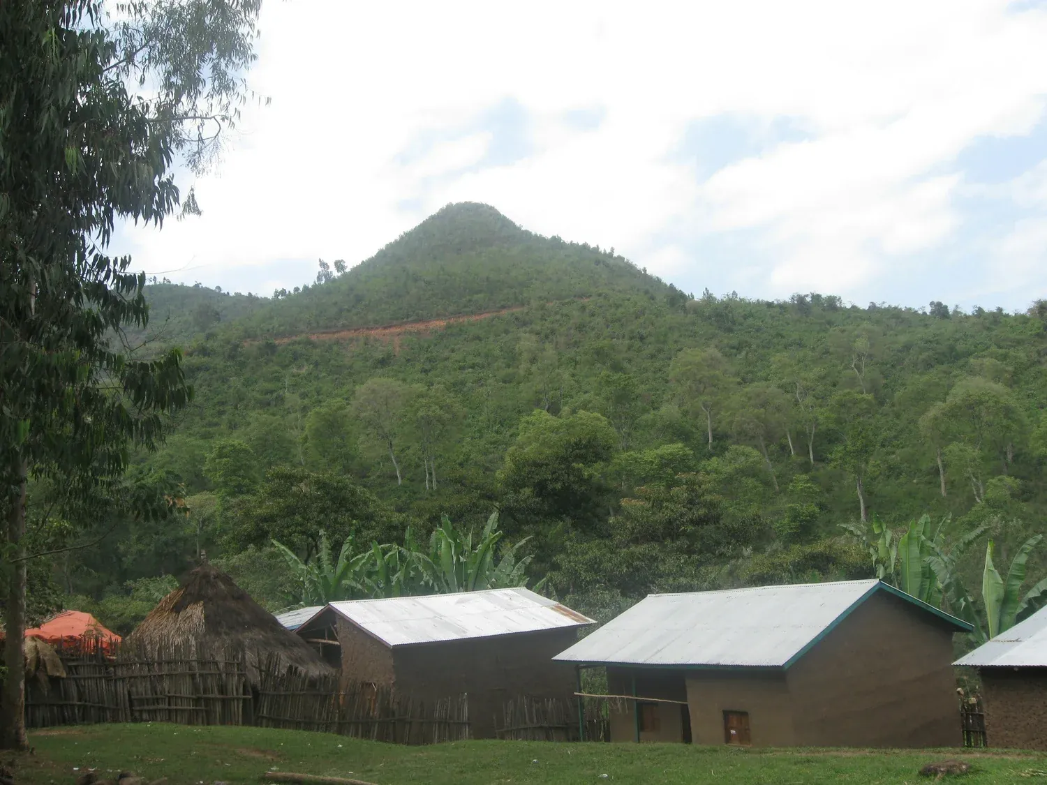 Green hills above a rural Ethiopian village